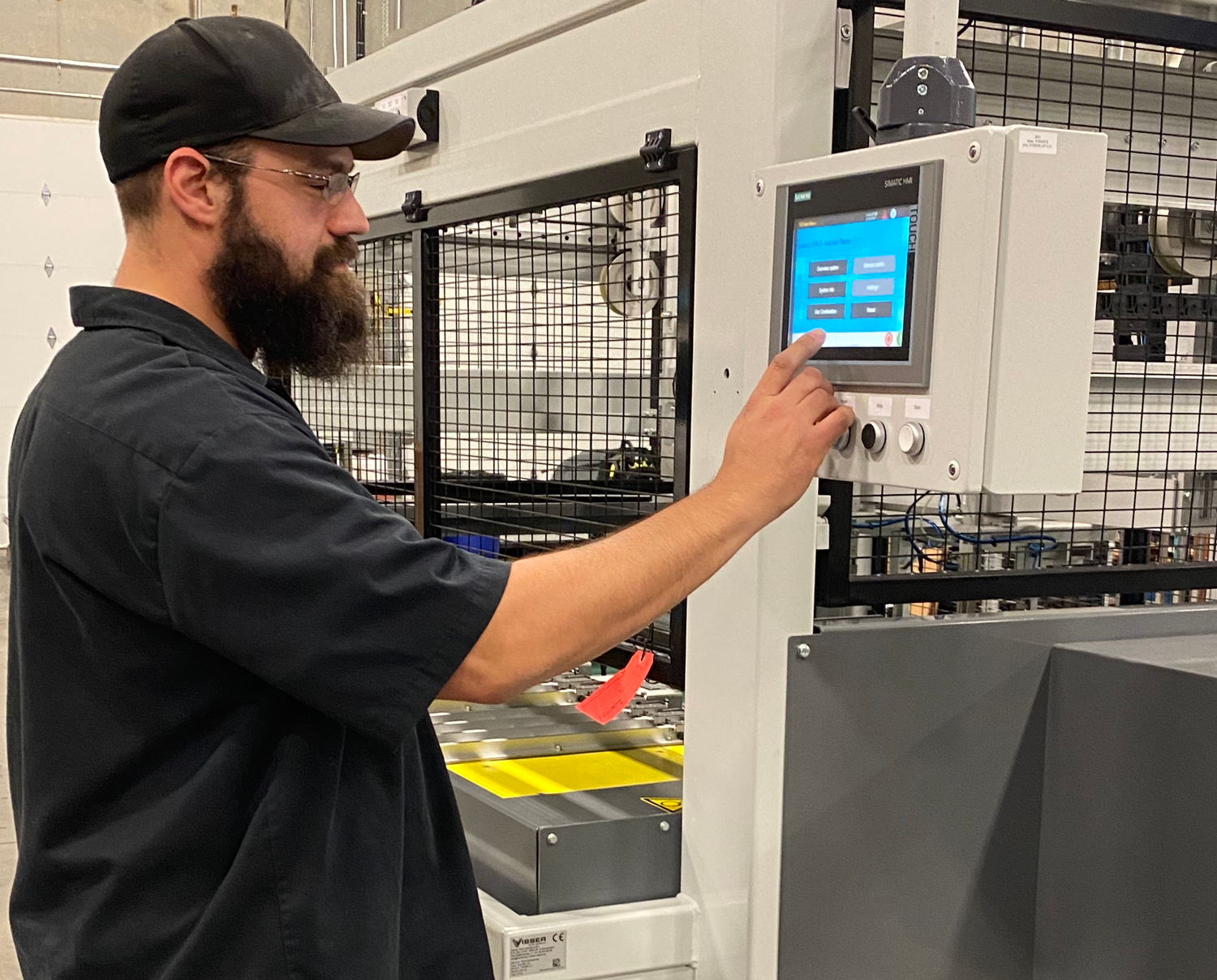 Service Solutions, AdeptAg Technician working on a machine.